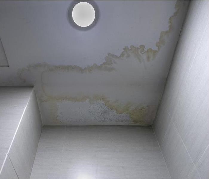 Undetected water from storm causes water stains in Phoenix home.